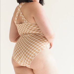 ARQ bodysuit size medium. Only worn twice. 98% cotton, Made in the USA.